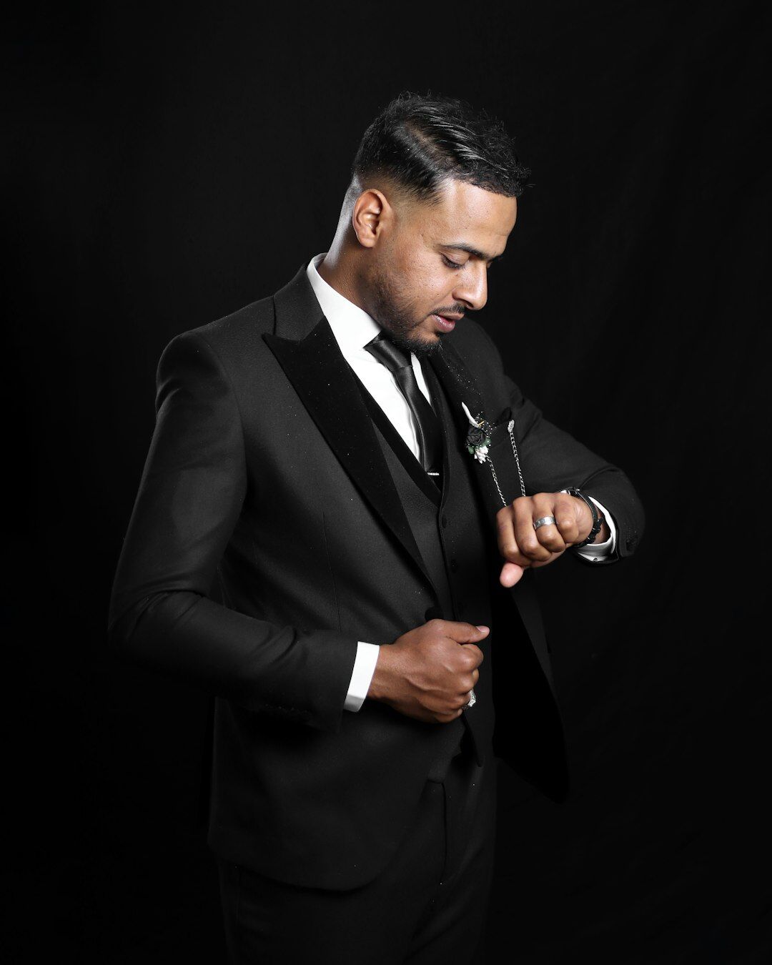 Studio portrait of a Black man leadership coach in a suit